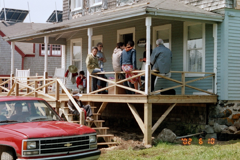 sitting on porch railing